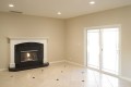 This exquisite and pristine living area was designed and built with the entertaining family in mind.  The fireplace is energy efficient with certified ratings for room heating as a gas unit and operates with an on the wall ignition switch.  The recessed lighting and large dual glazed sliding patio door bring in light during the day and keep the area illuminated during the evening.  The designer full tile floor allows for dining and drinks indoor and out.