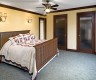 The new Master Bedroom matched the existing cottage home perfectly.  With the stained fir base, doors and casing, and milled crown molding the outcome was impeccable.  The two closet doors were installed with caned obscure glass for elegance and privacy.  The Homeowners period piece king-size bed fit seamlessly.