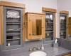 Adapting this existing restroom once the addition had been constructed was a challenge.  The medicine cabinet was custom created per the owner’s specifications and the two existing windows were converted to glassed cabinets for display of the owner’s antique grooming pieces.