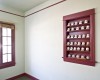 This existing bedroom was upgraded and finished once the addition was added and attached to the residence.  The west wall window was to be eliminated but with much care and design we were able to convert the opening to a display case for the owners historic signed baseball collection.